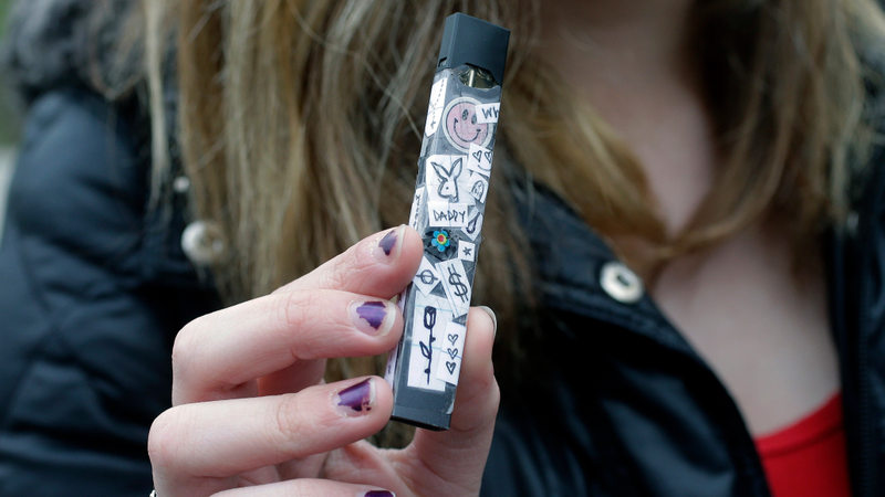 A 15-year-old shows off their Juul.